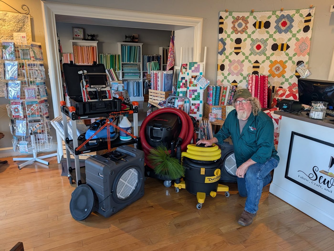 Darrin McCleskey with M-n-M duct cleaning equipment at Sew Chic Fabrics